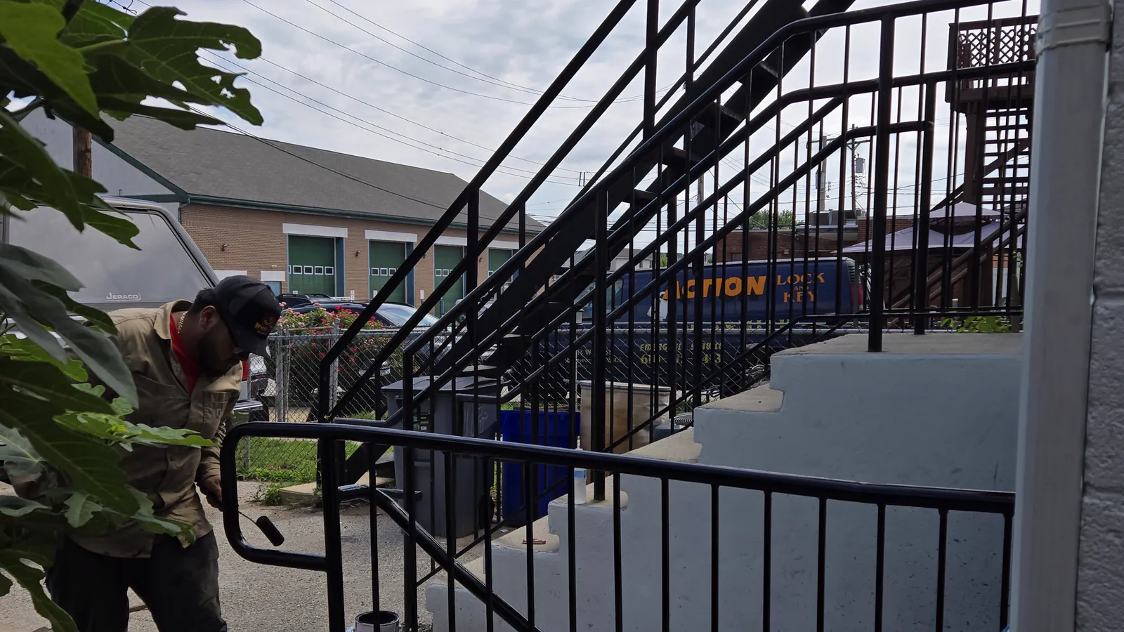 Steel stair and railing installation in progress on a building