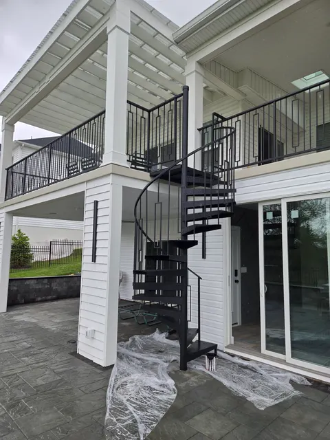 Spiral staircase to a second-floor deck