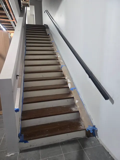 Wall-mounted steel handrail